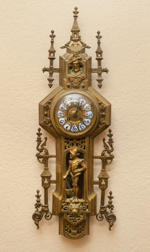 Appraisal: CONTINENTAL CAST BRASS WALL CLOCK A most unique architectural and