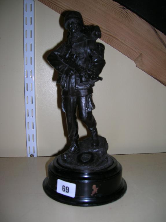 Appraisal: A cast resin statuette of a modern British infantryman in