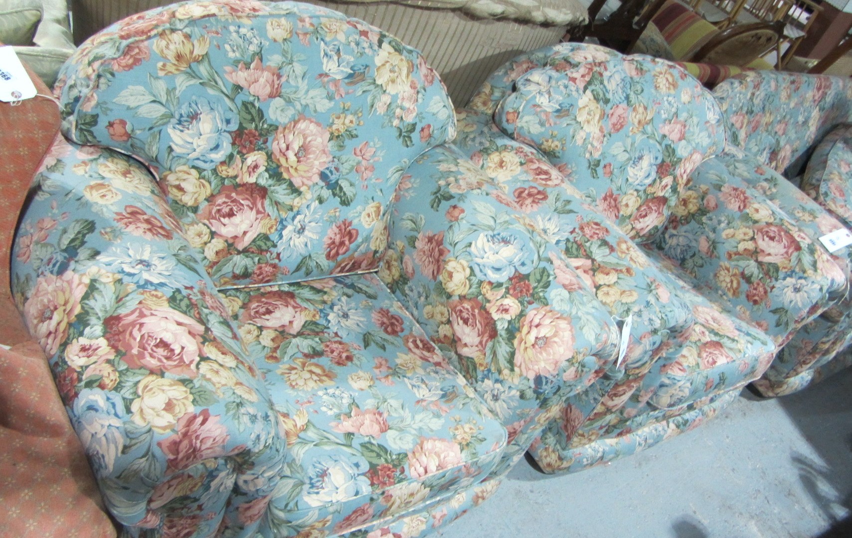 Appraisal: A two seater floral sofa a pair of matching chairs