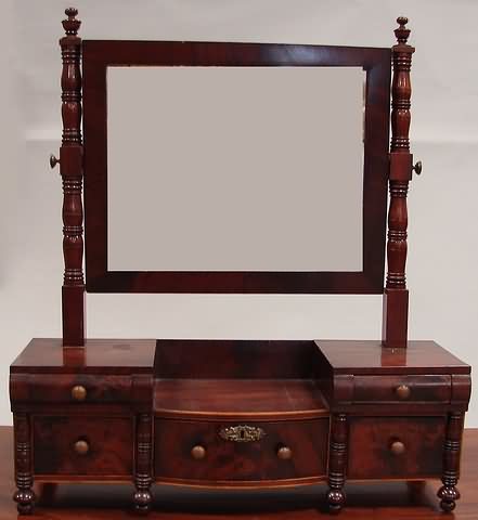 Appraisal: Figured Mahogany Turned stiles supporting a rectangular mirror over a