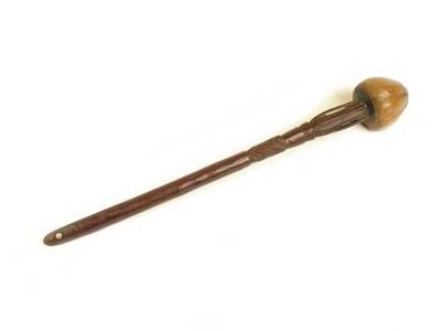 Appraisal: A South African carved wood knobkerry with a tapering handle