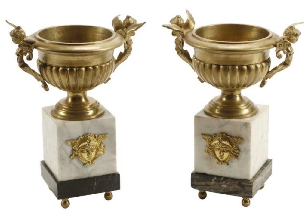 Appraisal: pair French bronze dore urns ribbed urn with figural winged