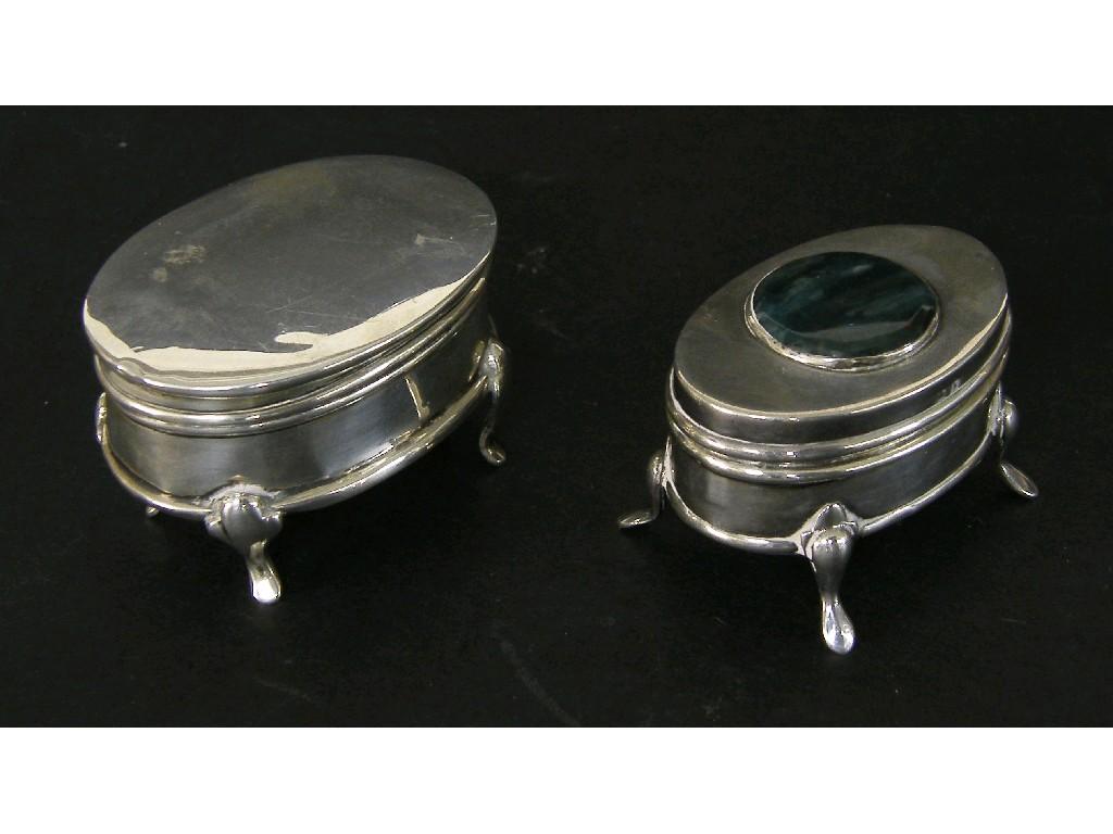 Appraisal: Oval silver trinket box the hinged lid with applied hardstone