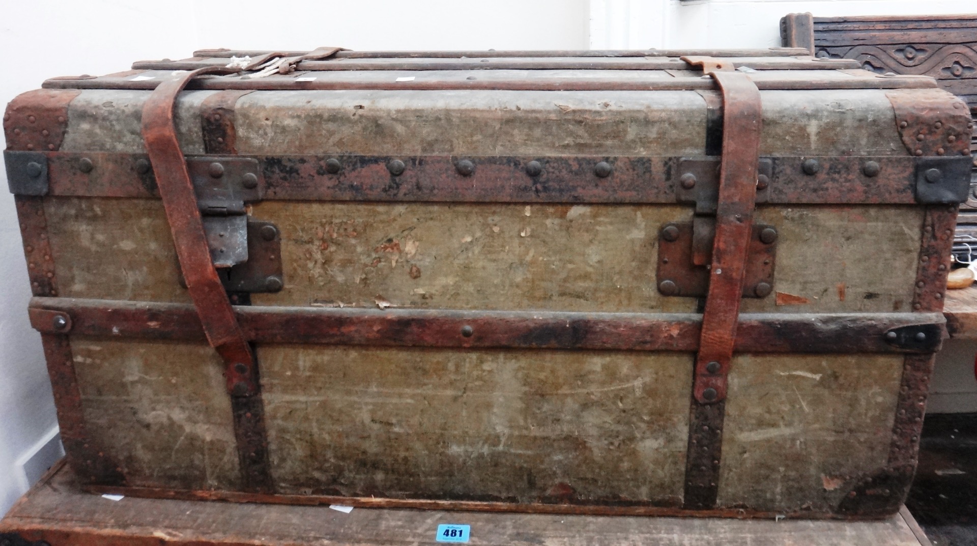 Appraisal: A French metal bound wooden battened canvas covered trunk late