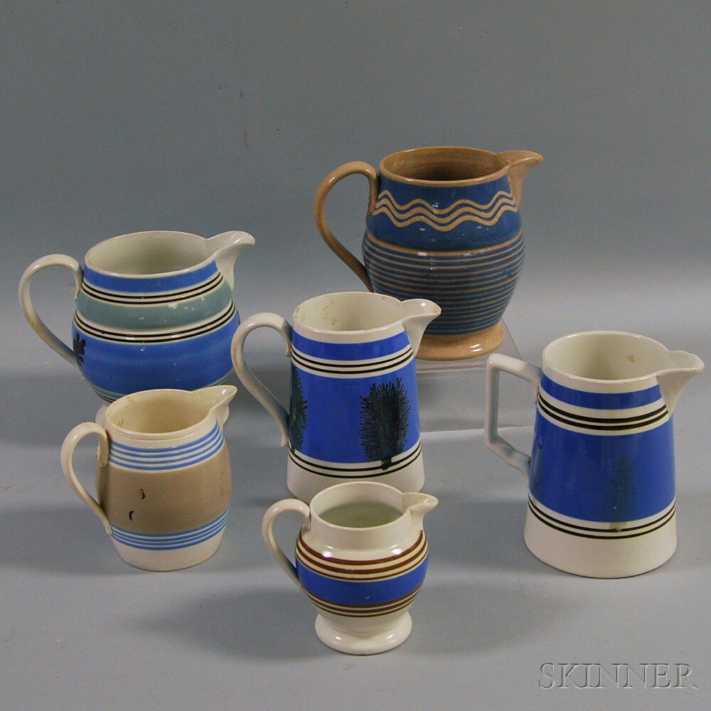 Appraisal: Six Mochaware Vessels England an earthenware pitcher a leaf-decorated pitcher