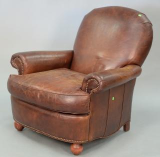 Appraisal: Brown leather easy chair Brown leather easy chair