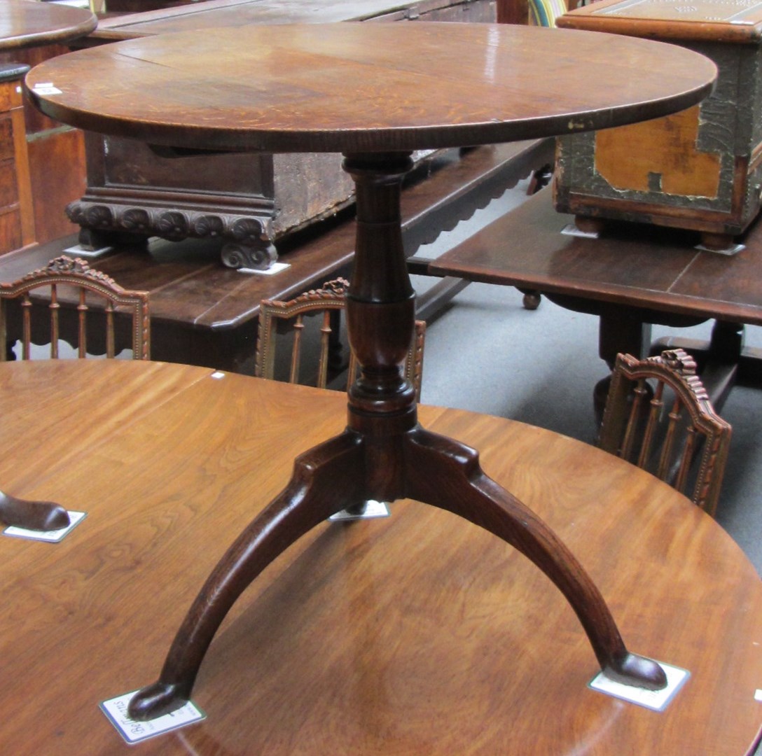 Appraisal: A mid th century oak occasional table the circular snap