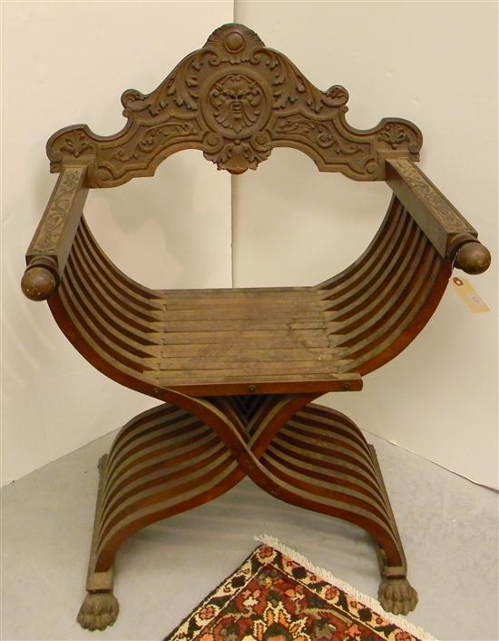 Appraisal: Savonarolla form armchair carved arms and backrest claw feet some