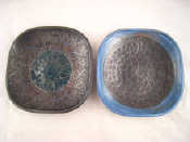 Appraisal: Troika A pair of squared circle plates in charcoal and