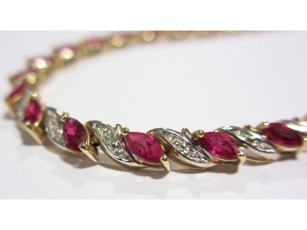 Appraisal: A ruby and diamond line bracelet set with twenty two