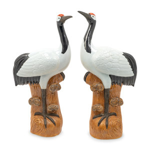 Appraisal: A Pair of Chinese Black and White-Glazed Porcelain Geese Hegiht