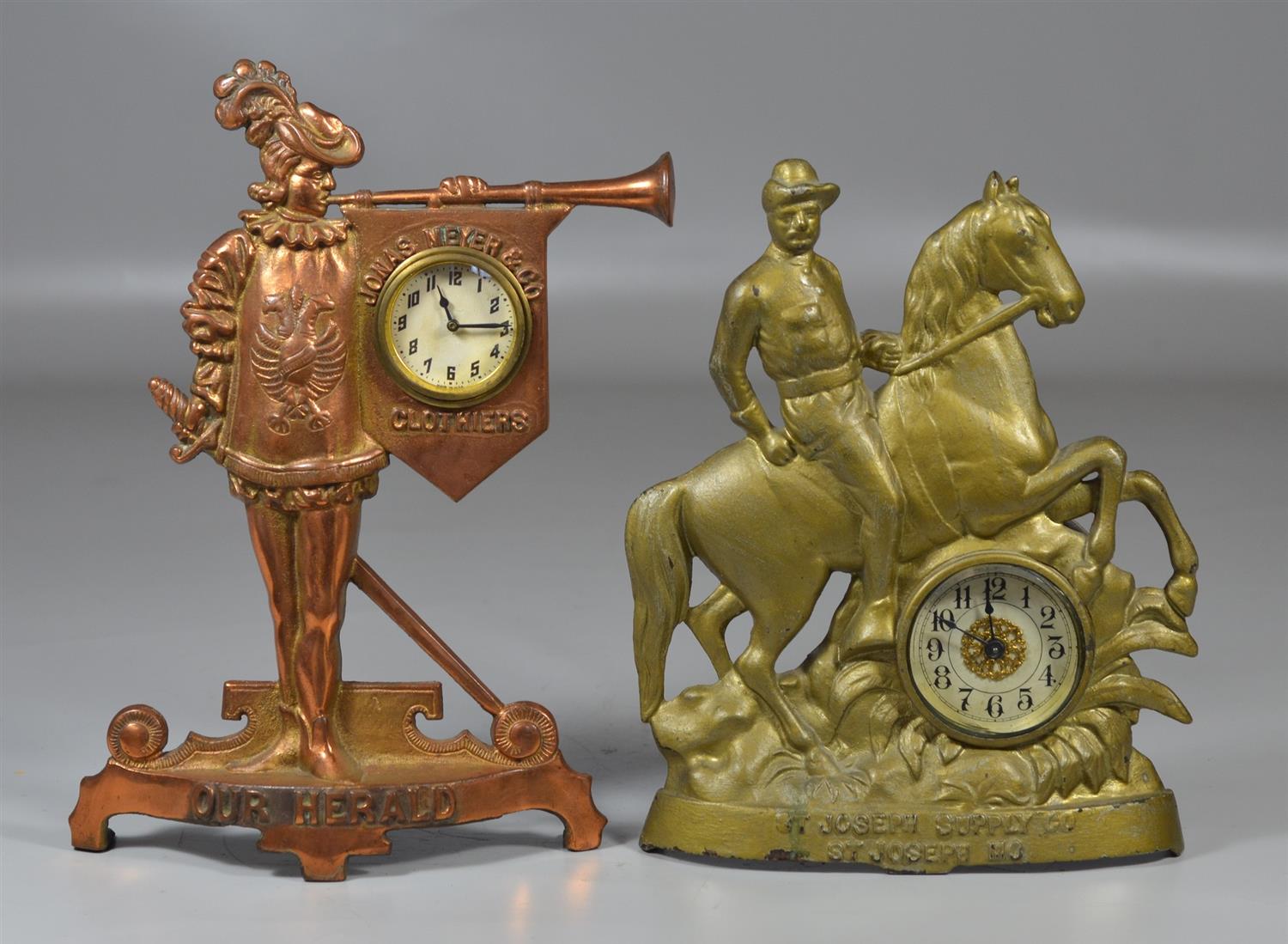 Appraisal: Cast iron figural advertising clocks St Joseph Supply Company St