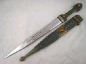 Appraisal: An Eastern short sword the hilt and scabbard decorated with