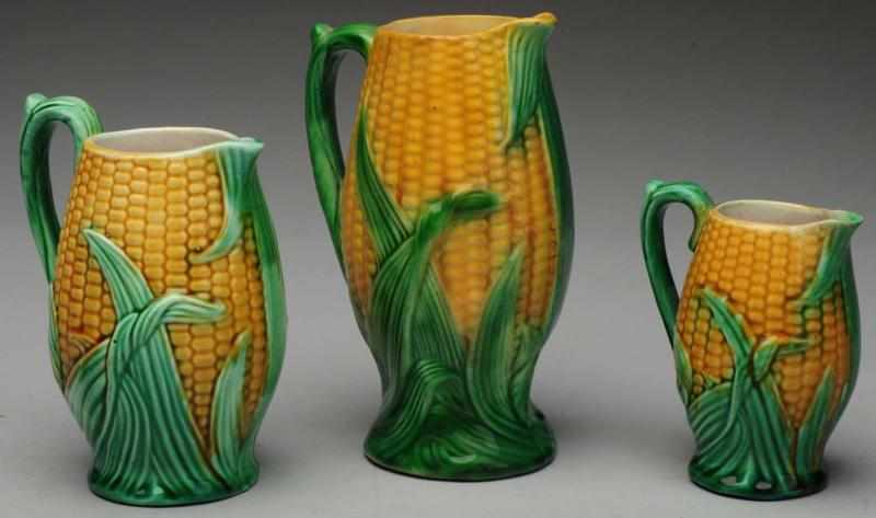 Appraisal: Lot of Majolica Corn Pitchers Repairs and imperfections to the