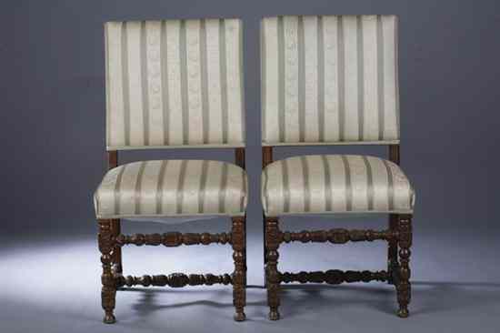 Appraisal: PAIR BAROQUE STYLE CARVED OAK HALL CHAIRS Padded back above