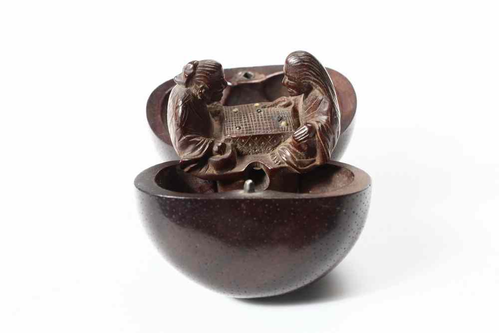 Appraisal: KARAKURI NETSUKE - 'Trick' Netsuke probably an anniversary gift carved