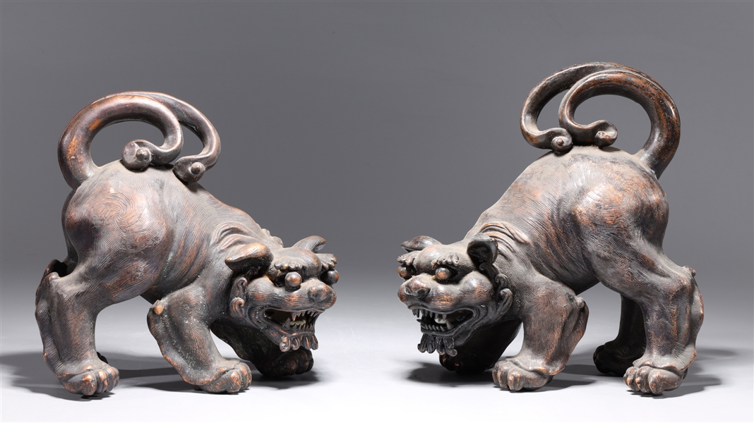 Appraisal: Pair of Chinese ceramic imitating bronze foo lions overall good