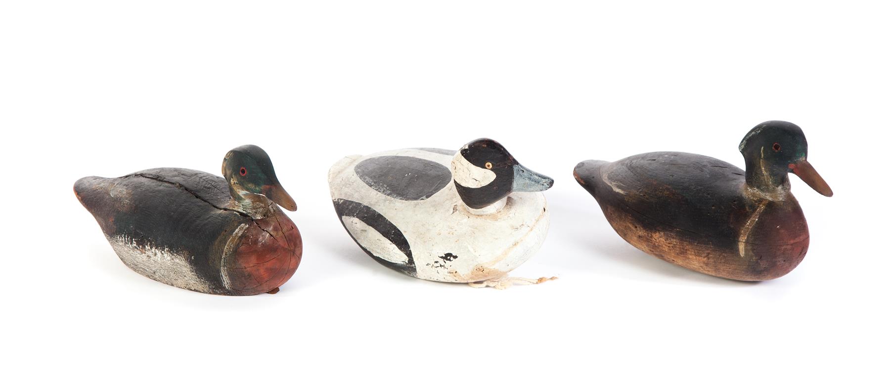 Appraisal: THREE AMERICAN DUCK DECOYS Mid th century Goldeneye from Maine