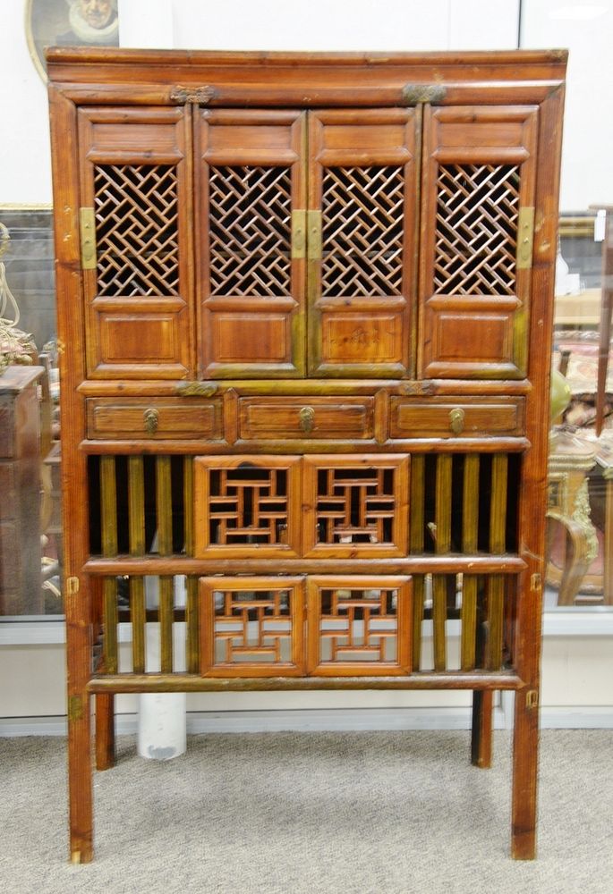 Appraisal: Chinese kitchen cabinet having pierce work doors th C ht