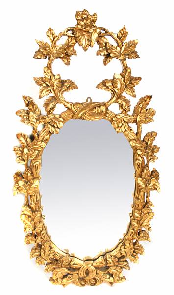 Appraisal: A Rococo style giltwood mirror height in