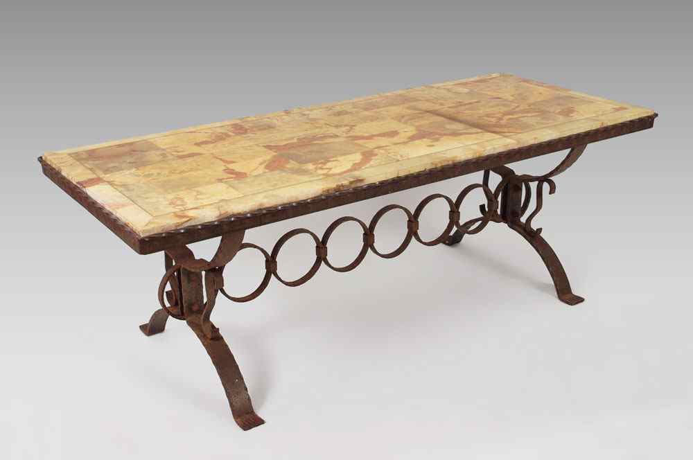 Appraisal: HANDCRAFTED IRON ONYX TOP COFFEE TABLE Spanish style hand tooled