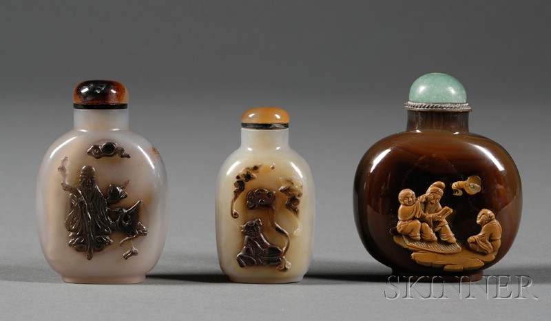 Appraisal: Three Shadow Agate Snuff Bottles one carved with a scholar