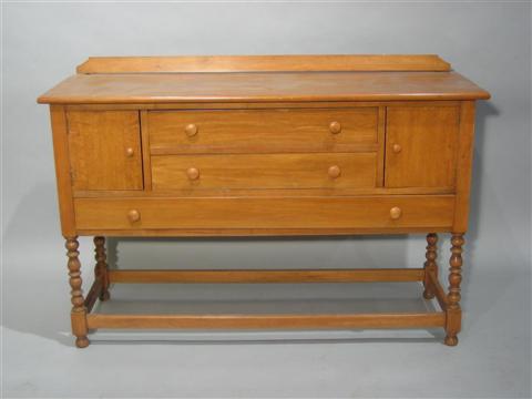 Appraisal: COLONIAL STYLE FRUITWOOD DRESSER The rectangular top over two drawers