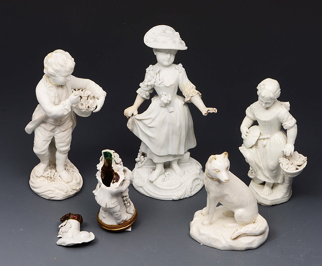 Appraisal: A DERBY WHITE BISCUIT FIGURE of a boy with basket