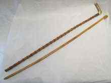 Appraisal: Two cane walking sticks one with silver mounted antler handle