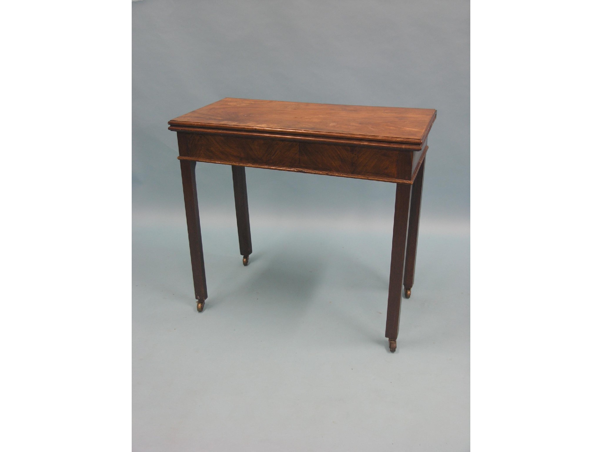 Appraisal: A Chippendale-period mahogany card table rectangular with baize lining one