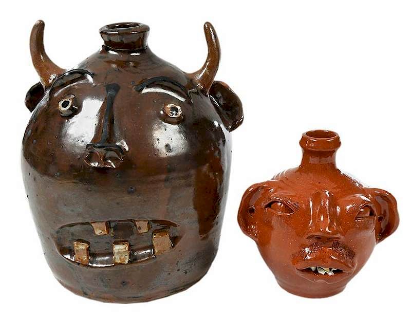 Appraisal: Two Stoneware Face Jugs th century stoneware clay with clear