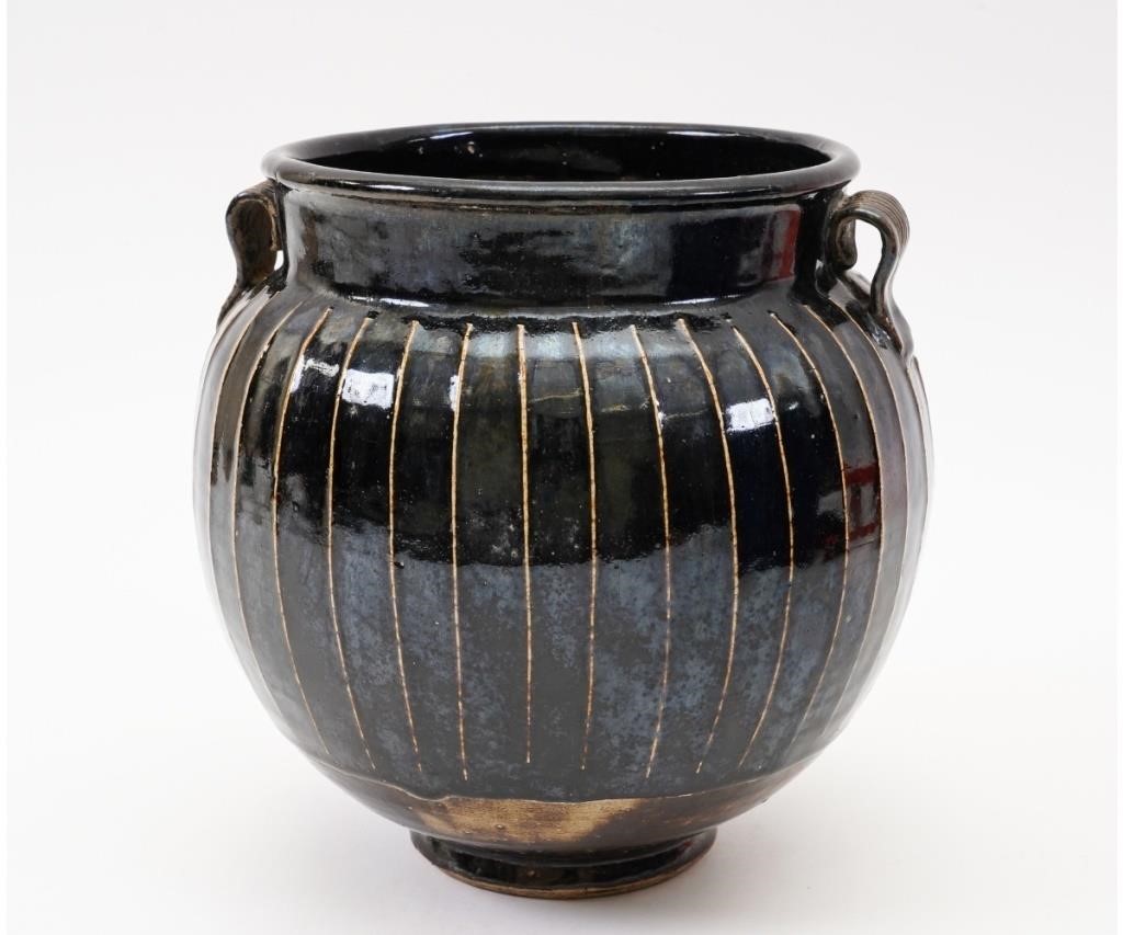 Appraisal: Chinese large wide mouthed blackware Guan jar with vertical white