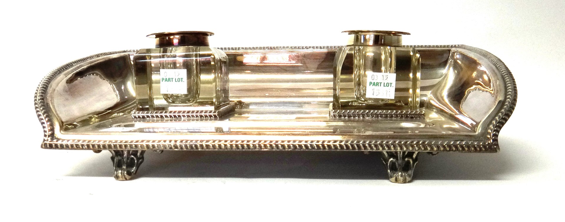 Appraisal: A silver plated twin bottle inkstand of shaped rectangular form