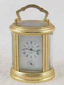 Appraisal: An oval brass French carriage clock by l'Epee with strike