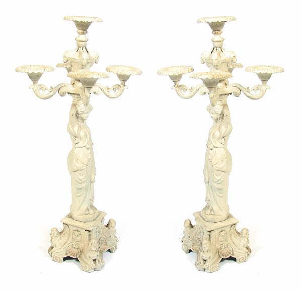 Appraisal: A pair of painted cast iron figural five light candelabra