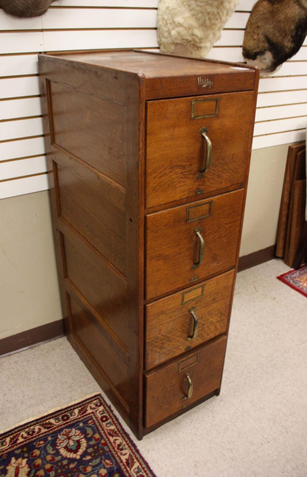 Appraisal: FOUR-DRAWER OAK FILE CABINET 'Utility' label American c having a