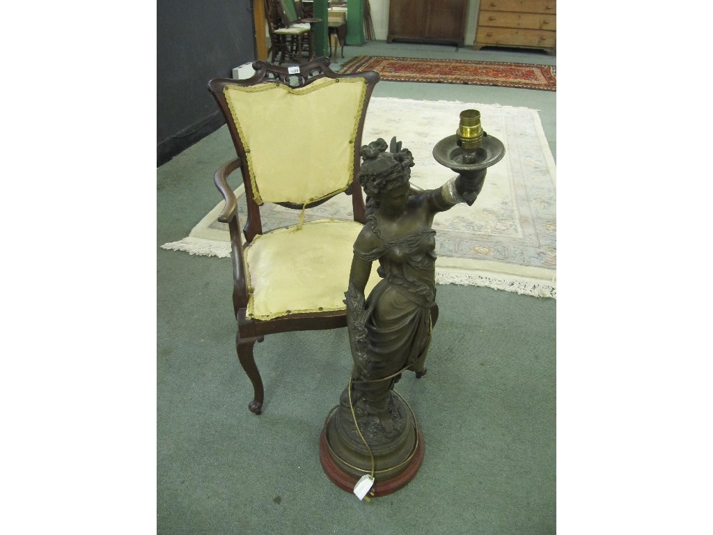 Appraisal: Edwardian parlour armchair and a spelter statue lamp