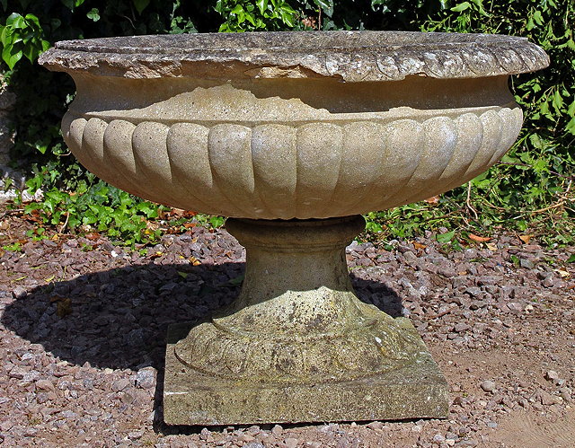 Appraisal: A LARGE HADDONSTONE URN of Fontainebleau from on a square