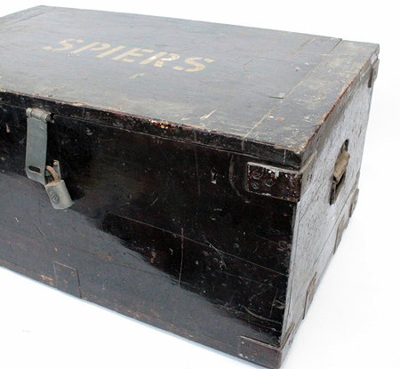 Appraisal: AN OLD TRAVELLING TRUNK with iron hasps the lid lifting