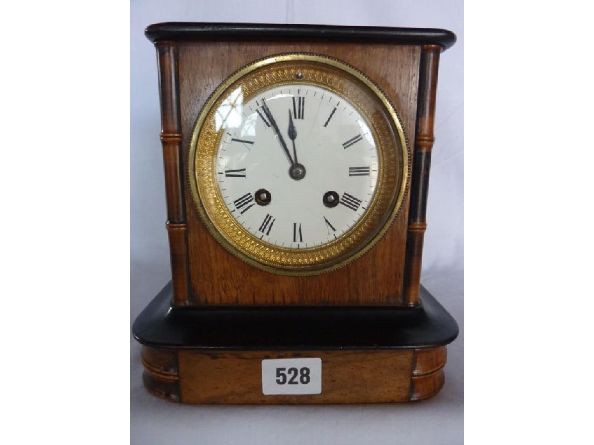 Appraisal: A small Victorian walnut mantle clock with simulated bamboo mouldings