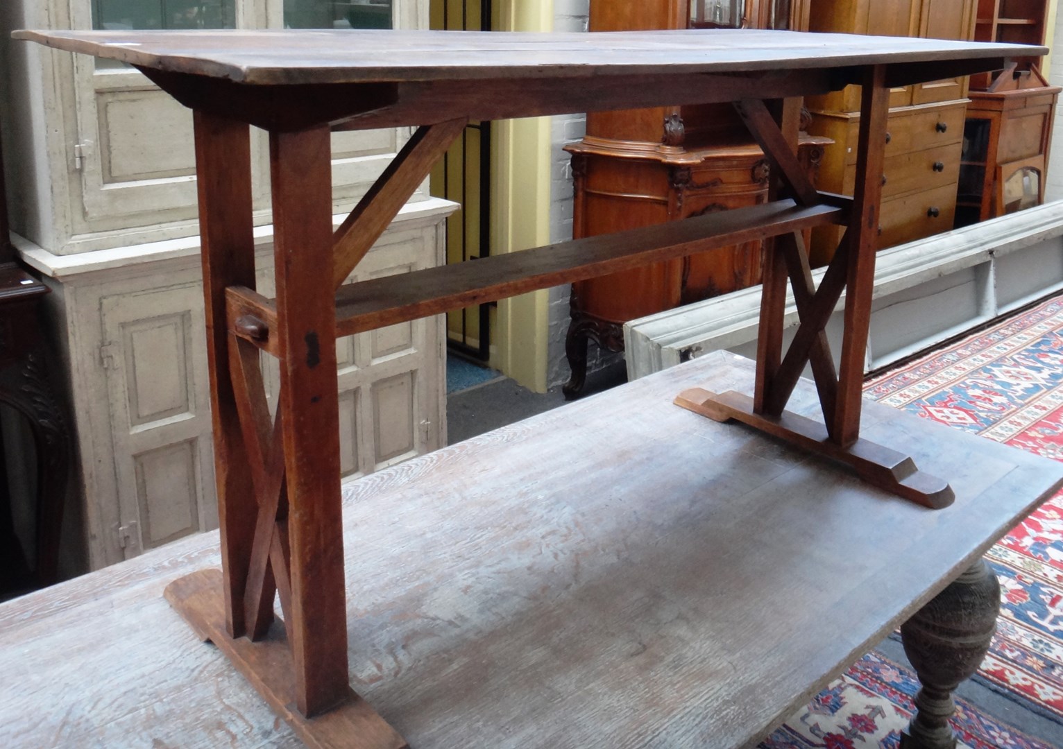 Appraisal: A stained pine and oak plank top table on 'X'