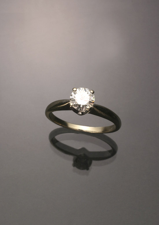 Appraisal: -Karat White-Gold Solitaire Diamond Ring The four-prong V-box mount set