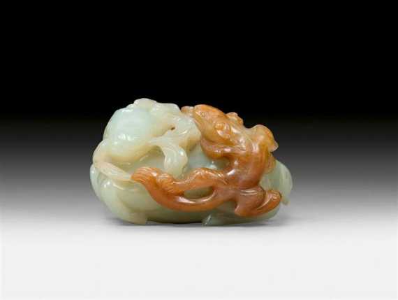 Appraisal: A CELADON AND BROWN JADE CARVING OF A DEER AND