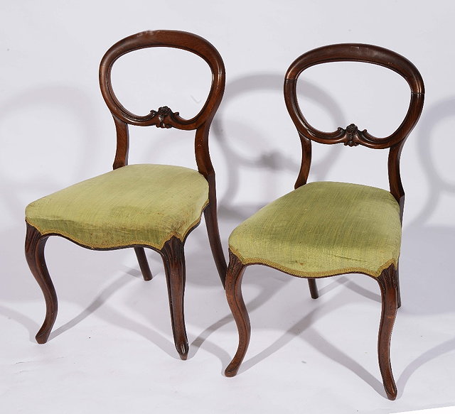 Appraisal: A pair of Victorian rosewood balloon back dining chairswith upholstered