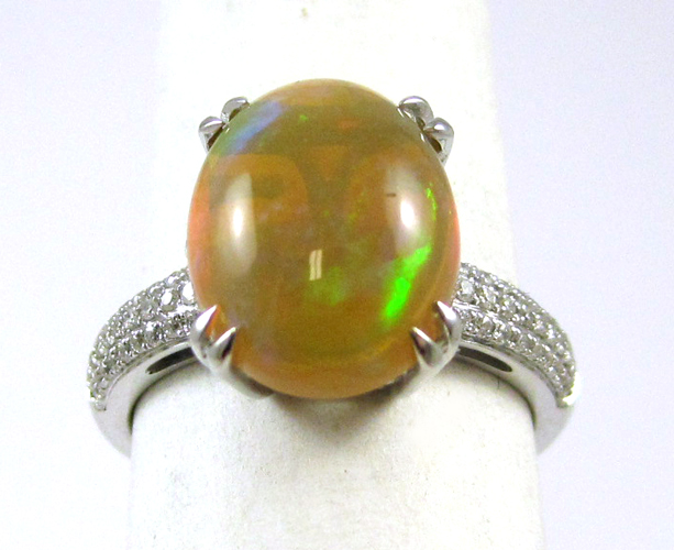 Appraisal: OPAL DIAMOND AND FOURTEEN KARAT GOLD RING The white gold