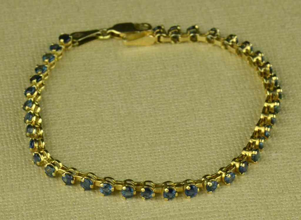 Appraisal: K Gold and Sapphire BraceletSapphire tennis-style bracelet set with many