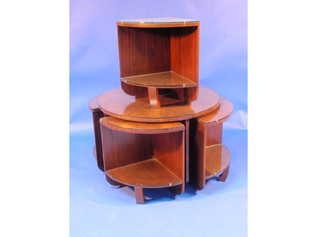 Appraisal: An Art Deco figured walnut nest of coffee tables of