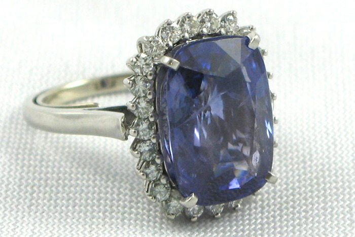 Appraisal: SAPPHIRE DIAMOND AND PLATINUM RING WITH APPRAISAL centering a rectangular