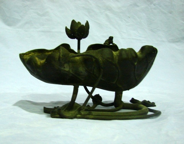 Appraisal: A Japanese bronze lotus leaf shaped bowl with applied frog