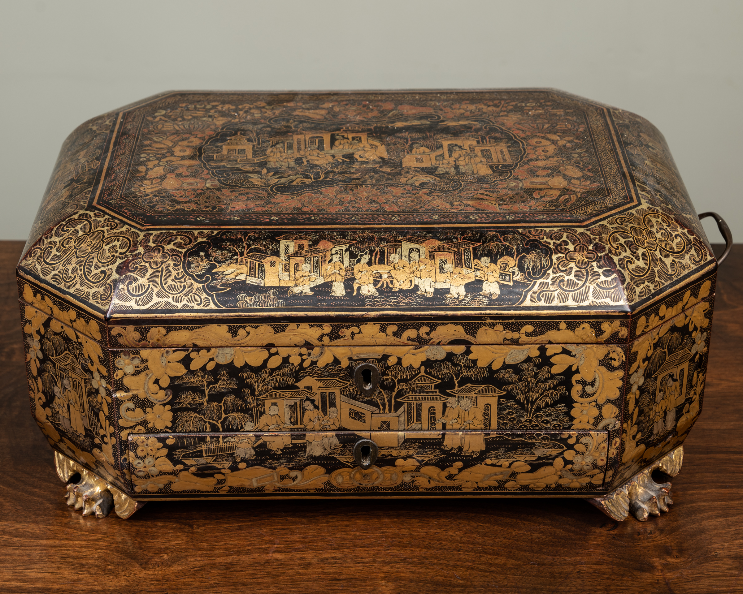 Appraisal: An antique Chinese lacquered work box with canted corners and